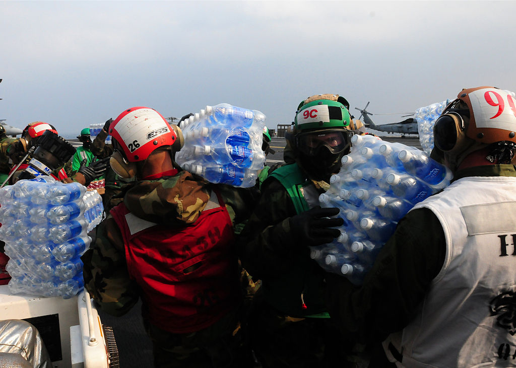 1024px-Flickr_-_Official_U.S._Navy_Imagery_-_Sailors_carry_water_to_helos_for_disaster_relief_efforts_in_Japan.